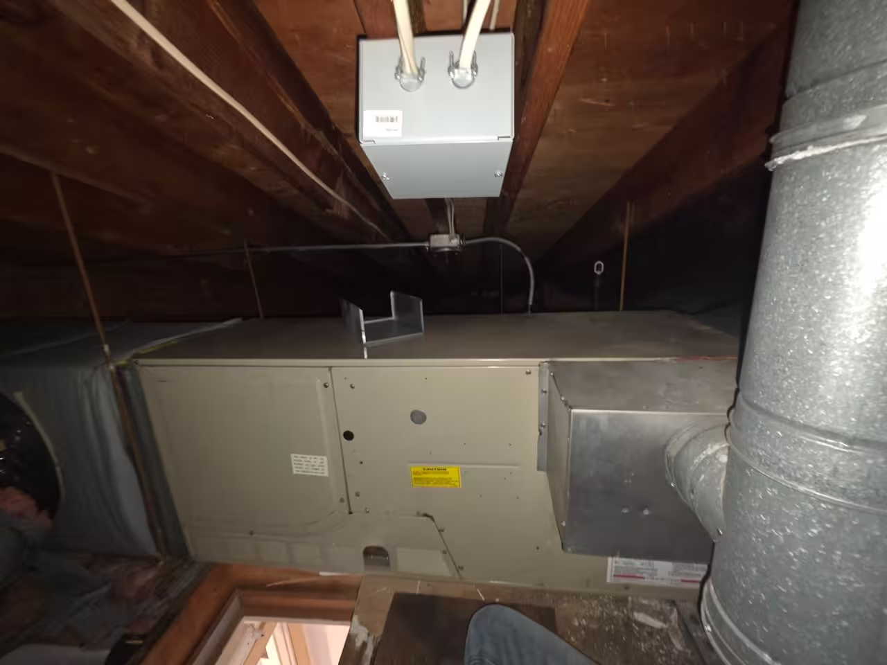 Air handler and HVAC ductwork installed in a residential attic